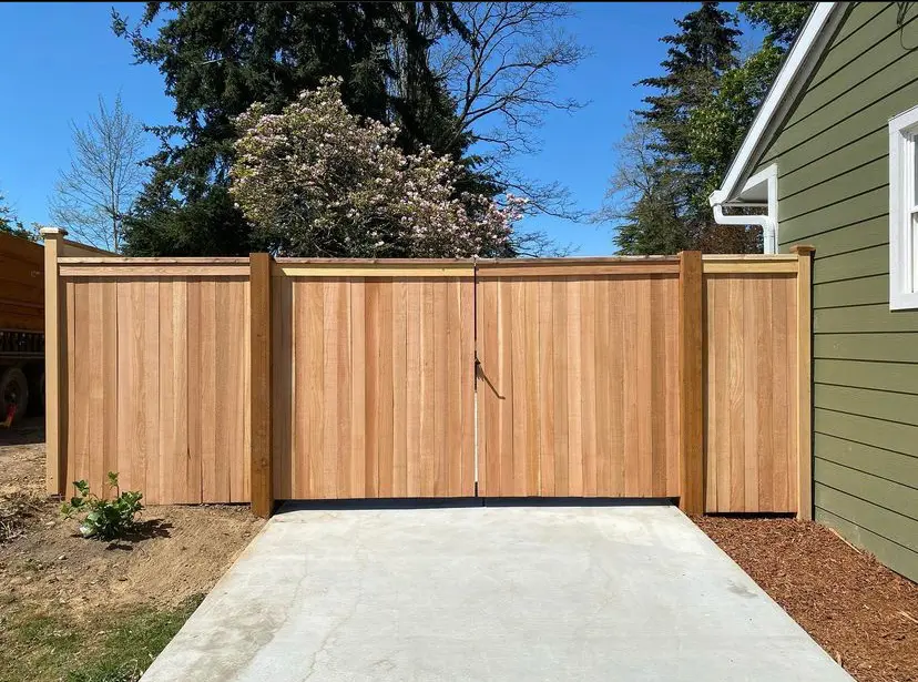 Wooden driveway gate installed in a Seattle home