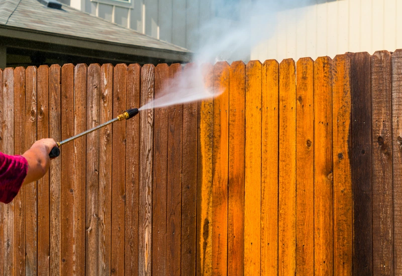 Pressure washing a cedar fence in Seattle using low pressure