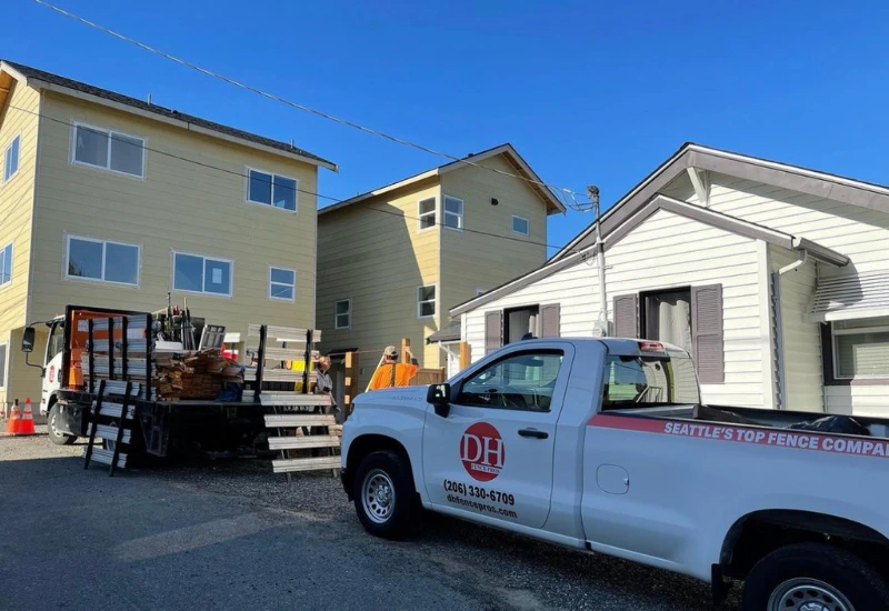 DH Fence Pros service truck parked in a Seattle neighborhood