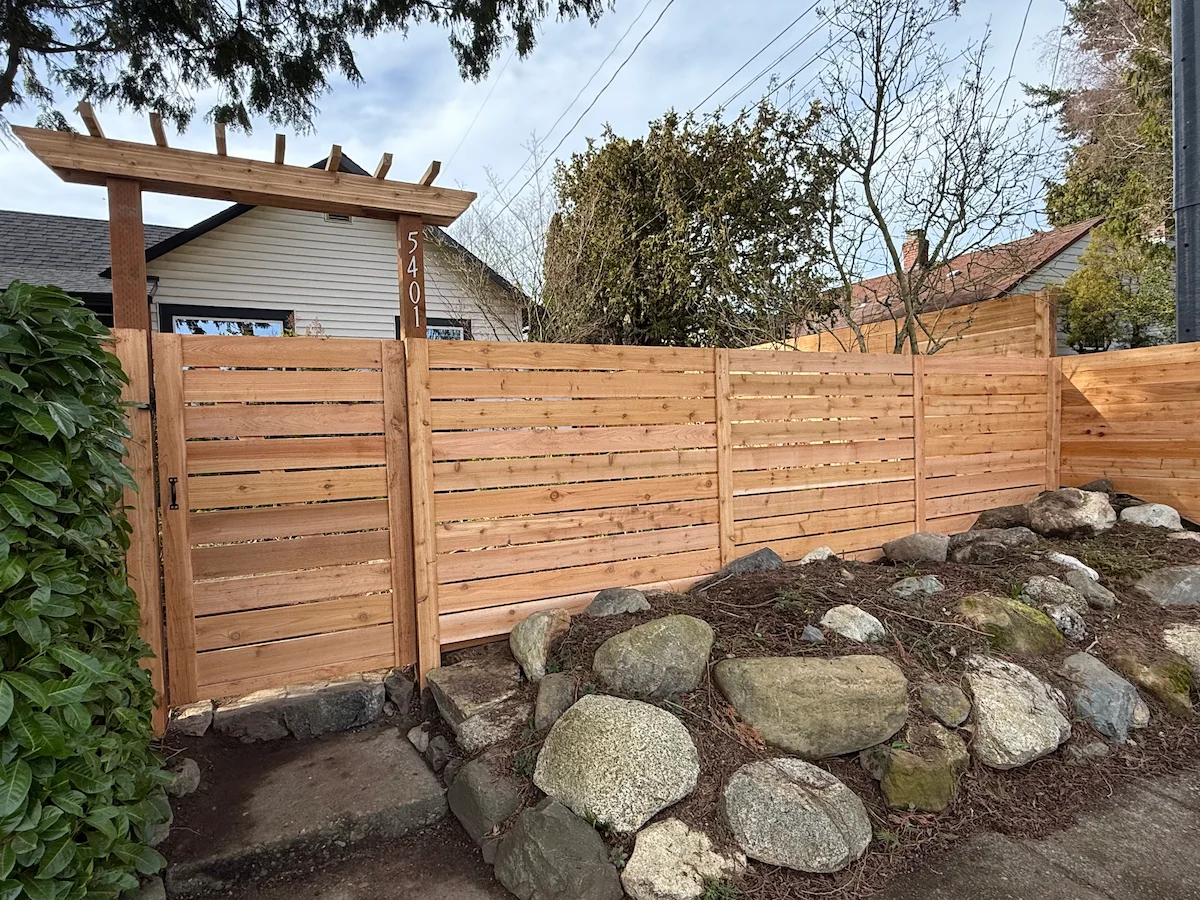 Modern horizontal cedar front yard fence designed to enhance curb appeal and privacy for a Seattle home.
