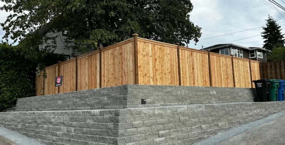 Cedar fence installed on top of a retaining wall in Seattle